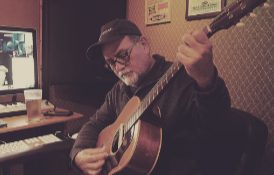 Acoustic guitar take at the console