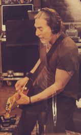 Electric guitar over the pedalboard