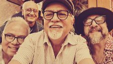 The band crowded into a selfie in the studio